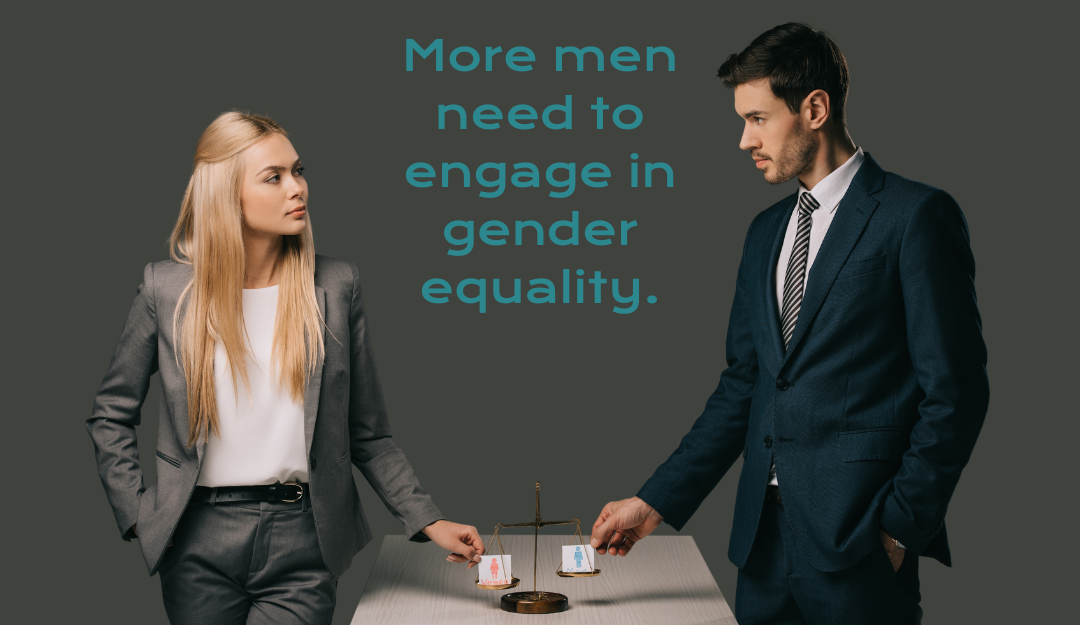 Suited woman and man standing at a table putting gender cards on a set of brass scales.